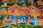 Luang Prabang, Laos - Wat Xieng Mouan with the faade decorated with brightly painted Jataka tales. 